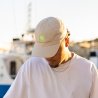 Alto beige cap, neon green embroidery and metallic shooting man